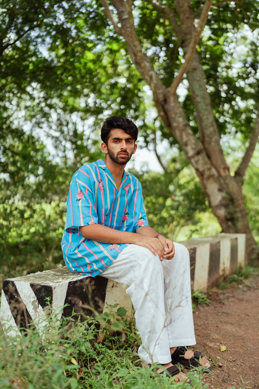 TREEJM's "Rangeela" Cuban Shirt combines hand-woven cotton quality with a relaxed striped design and Cuban collar, ensuring comfort and a trendy look.