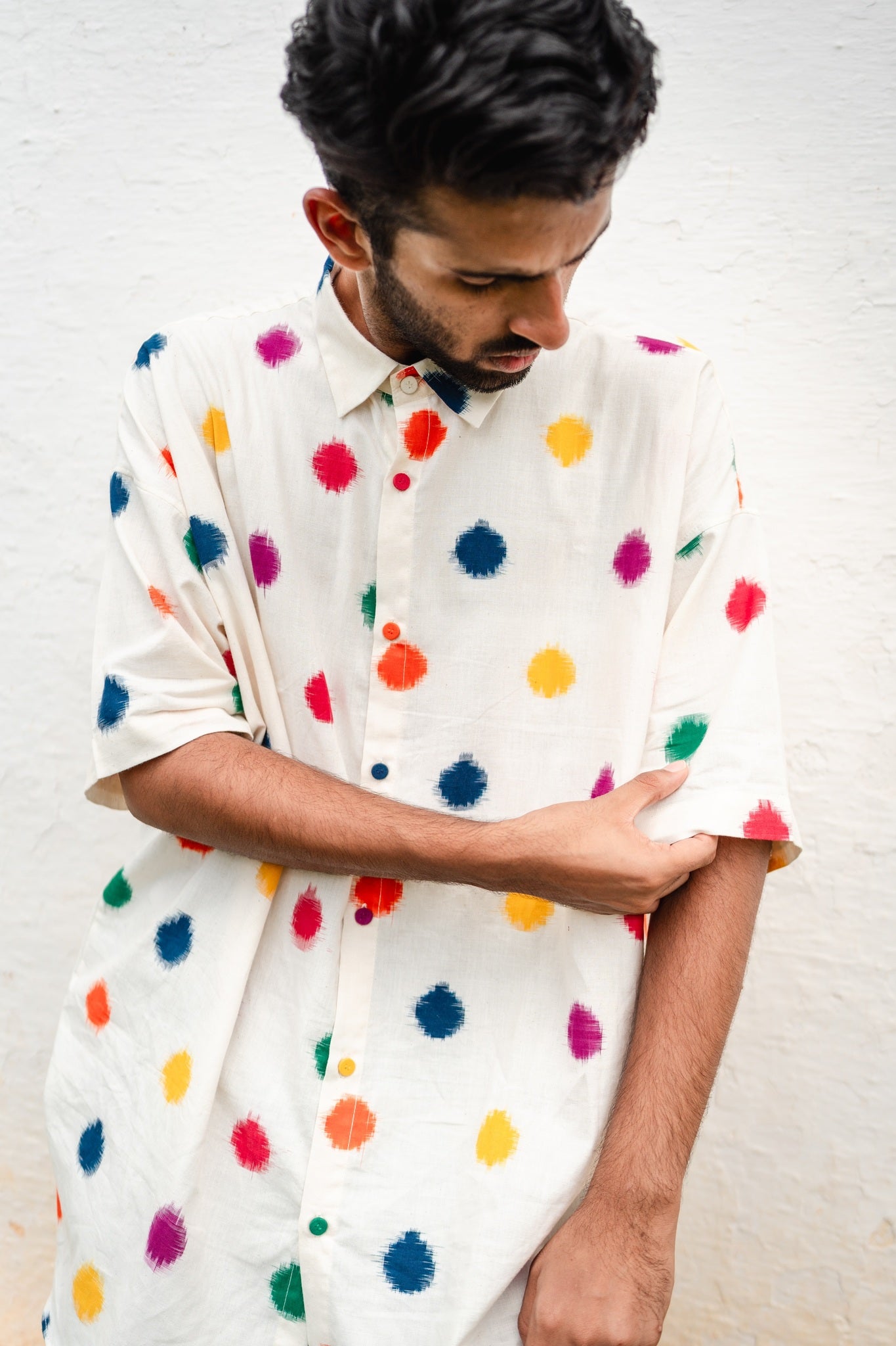 Rangeela Men's Polka Shirt, handwoven from breathable cotton, boasts lasting vibrant colors from special dyeing. Relish traditional craftsmanship in classic style.